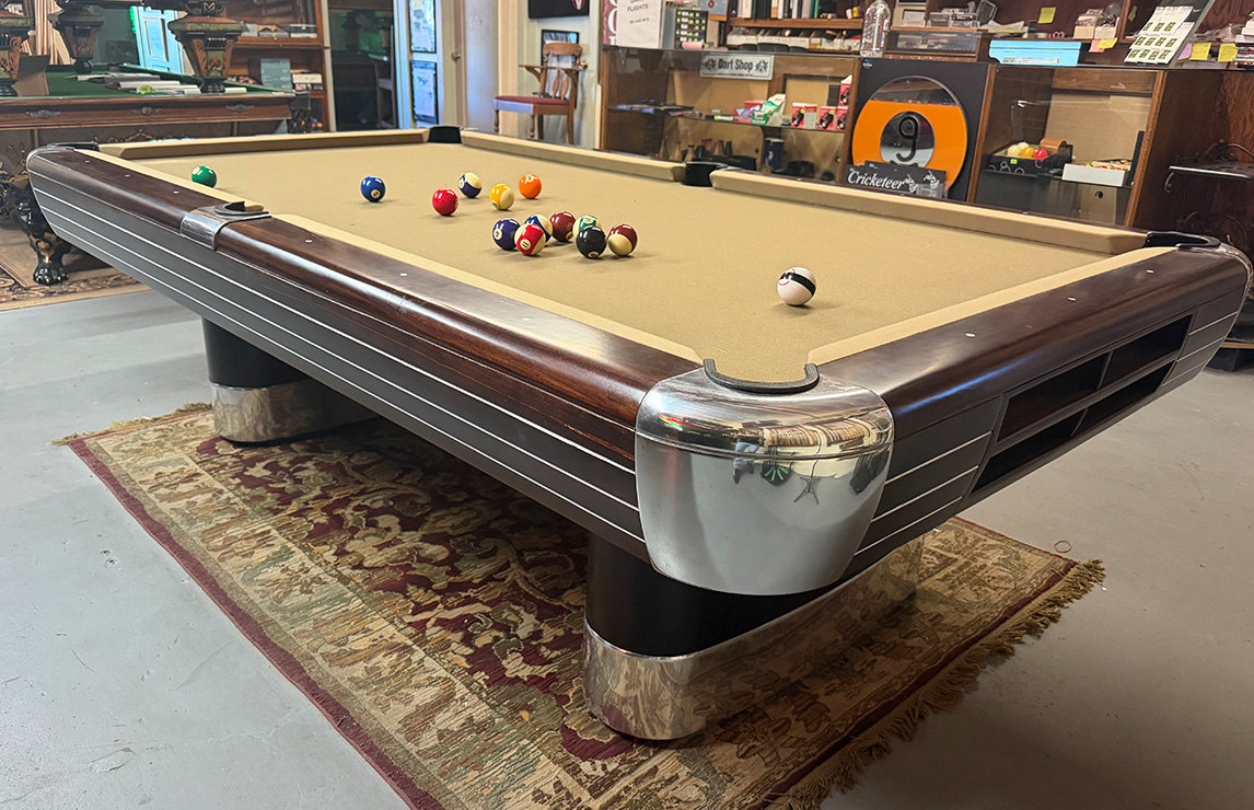 Streamline mid-century modern pool table with polished chrome corners and tan felt, fully restored by Sequoia Billiard Supply.